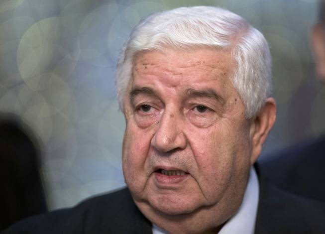 Syrian Foreign Minister Walid al-Moallem speaks to the media in Moscow, Monday, Sept. 9, 2013. Syria's foreign minister said his country welcomes Russia's proposal for it to place its chemical weapons under international control and then dismantle them quickly to avert U.S. strikes.