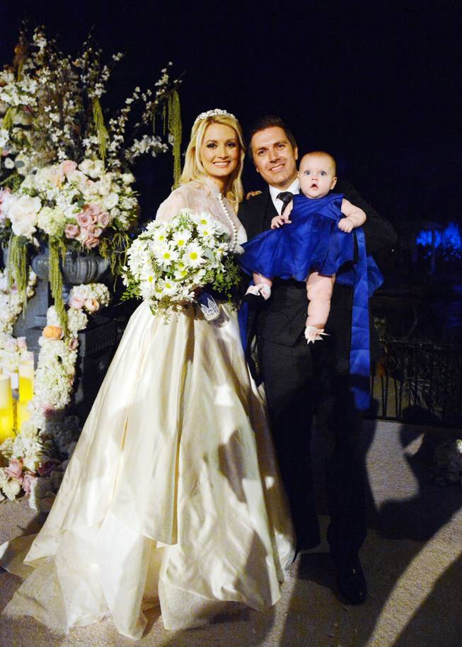 Holly Madison and Pasquale Rotella’s wedding on Tuesday, Sept. 10, 2013, at Disneyland in Anaheim, Calif. The couple are pictured here with their daughter, Rainbow Aurora.