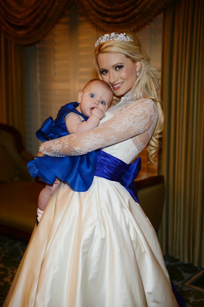 Holly Madison and Pasquale Rotella’s wedding on Tuesday, Sept. 10, 2013, at Disneyland in Anaheim, Calif. Madison is pictured here with their daughter, Rainbow Aurora.