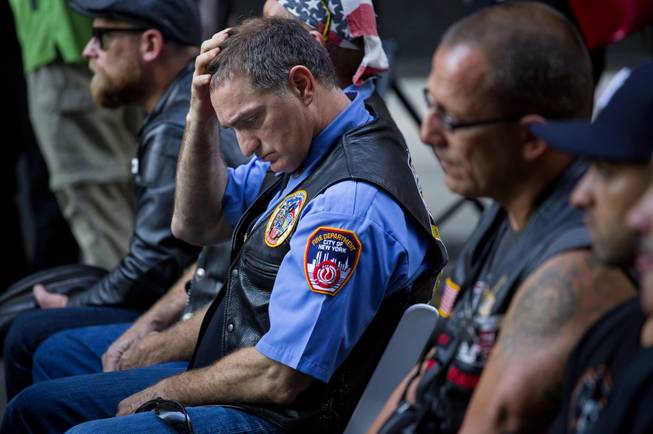 Retired FDNY Marshal Ernie Medaglia, of Bronxville, N.Y., who was at the attacks at the World Trade Center on Sept. 11, 2001, is emotional as he listens to New York Gov. Andrew Cuomo at a ceremony near the 9/11 Memorial honoring first responders and FDNY Rescue 1 on the 12th anniversary of the attacks on the World Trade Center in New York Wednesday, Sept. 11, 2013.