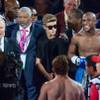 Boxers Floyd "Money" Mayweather Jr. of Las Vegas, right, with Justin Bieber, second from right, and Saul "Canelo" Alvarez of Guadalajara, Mexico, battle at MGM Grand Garden Arena on Saturday, Sept. 14, 2013. Mayweather Jr. defeated Alvarez by decision after 12 rounds. Boxers Floyd "Money" Mayweather Jr. of Las Vegas, right, with Justin Bieber, second from right, and Saul "Canelo" Alvarez of Guadalajara, Mexico, battle at MGM Grand Garden Arena on Saturday, Sept. 14, 2013. Mayweather Jr. defeated Alvarez by decision after 12 rounds.