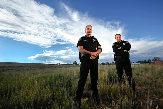 Albany County Sheriff David O'Malley, left, and Under Sheriff Rob DeBree in Laramie, Wyoming, near where Matthew Sheppard was beaten and left hanging on a fence in an anti-gay crime 15 years ago. Sheppard died of his injuries soon after the October 12, 1998, attack.