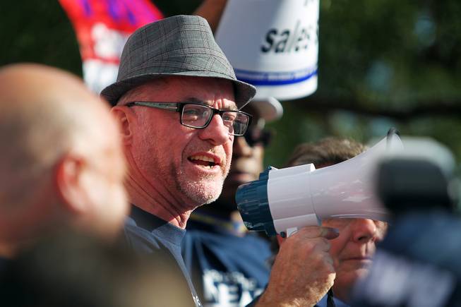 Tony Sheldon, a Transit Workers Union member from Australia, speaks to over 300 members of the TWU as they picket outside of Allegiant Air headquarters Thursday, Sept. 26, 2013. The union members were trying to raise awareness of Allegiant's customer service record as well as their inability to reach a labor agreement with more than 600 of their flight attendants.