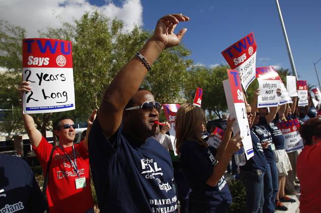 Over 300 members of the Transit Workers Union, in town for their convention, picket outside of Allegiant Air headquarters Thursday, Sept. 26, 2013. The union members were trying to raise awareness of Allegiant's customer service record as well as their inability to reach a labor agreement with more than 600 of their flight attendants.