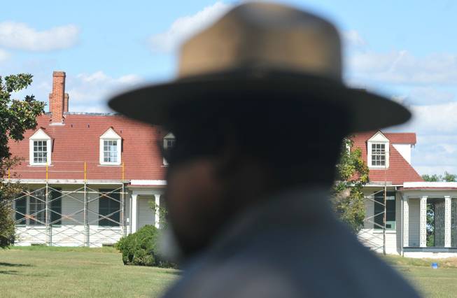 Lewis Rogers, superintendent of Petersburg National Battlefield, stands in the shade as he talks about the impact of a potential government shutdown Monday, Sept. 30, 2013 near Appomattox Manor at City Point in Hopewell, Va. The Civil War-focused park would close if the government shuts down.