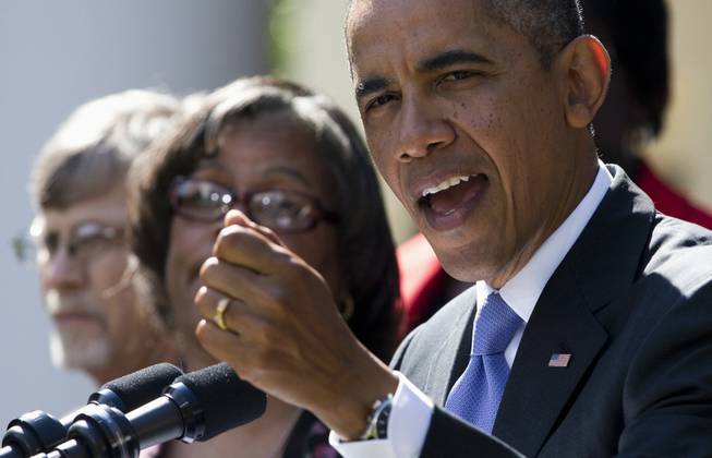 President Barack Obama gestures while speaking in the Rose Garden of the White House in Washington, Tuesday, Oct. 1, 2013, about the government shutdown. Congress plunged the nation into a partial government shutdown Tuesday as a protracted dispute over Obama's signature health care law reached a boiling point, forcing some 800,000 federal workers off the job.