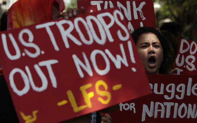 A Filipino protester shouts slogans during a rally near the U.S. embassy to oppose the planned visit of U.S. President Barack Obama in Manila, Philippines on Wednesday Oct. 2, 2013. Obama has canceled two stops, Malaysia and Philippines, on his long-planned trip to Asia because of the partial government shutdown, the White House announced Wednesday.