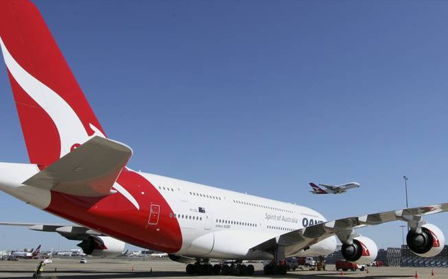 A Qantas A-380 takes off in Sydney, Australia, Thursday, Sept. 6, 2012. Qantas Airways Ltd. announced that it has signed a 10-year partnership deal with rival Emirates in a bid to boost the Australian airline's struggling international business. Under the alliance, Qantas will move its hub for European flights from Singapore to Dubai, coordinate with Emirates on ticket pricing and scheduling and apply a benefit-sharing model starting in April 2013. The deal is subject to regulatory approval.