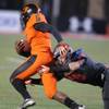 Bishop Gorman linebacker Chris Lalli tackles Booker T. Washington High of Miami quarterback Treon Harris for a loss during their game Friday, Oct. 4, 2013 at Bishop Gorman. Bishop Gorman linebacker Chris Lalli tackles Booker T. Washington High of Miami quarterback Treon Harris for a loss during their game Friday, Oct. 4, 2013 at Bishop Gorman.