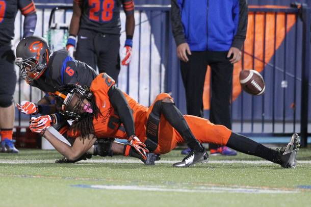 Booker T. Washington High of Miami defensive back Aquil Knowles injures his leg while covering Bishop Gorman wide receiver Terrance Chambers during their game Friday, Oct. 4, 2013 at Bishop Gorman. The No. 1 ranked Washington won the game 28-12.