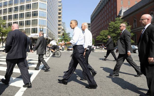 President Barapk Obama and Vice President Joe Biden leave the White House in Washington, Friday, Oct. 4, 2013, to pick up lunch at Taylor Gourmet sandwich shop near the White House. The president and vice president stepped out of the White House on a surprise and rare off-campus stroll to grab lunch at a neighborhood eatery.