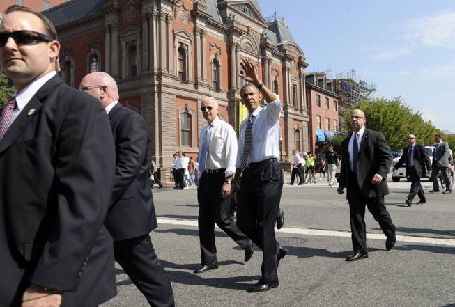 President Barack Obama and Vice President Joe Biden leave the White House in Washington, Friday, Oct. 4, 2013, to pick up lunch at Taylor Gourmet sandwich shop near the White House. The president vice president stepped out of the White House on a surprise and rare off-campus stroll to grab lunch at a neighborhood eatery.