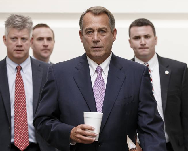 House Speaker John Boehner of Ohio walks to a Republican strategy session on Capitol Hill in Washington, Friday, Oct. 4, 2013. Boehner is struggling between Democrats that control the Senate and GOP conservatives in his caucus who insist any funding legislation must also kill or delay the nation's new health care law. Added pressure came from President Barack Obama who pointedly blamed Boehner on Thursday for keeping federal agencies closed.