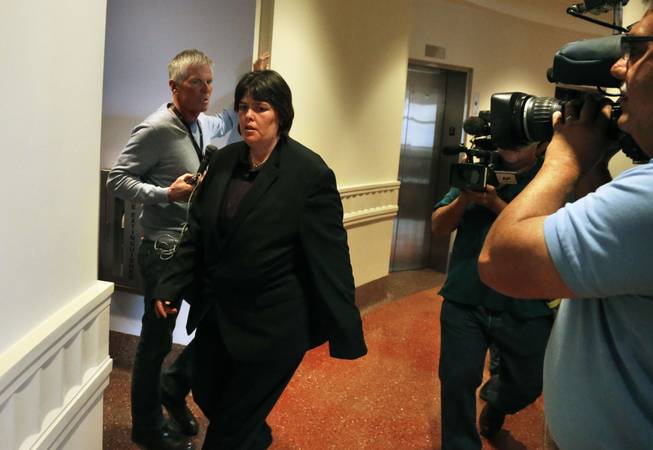 Lorinda Bailey enters a courtroom at the Denver Justice Center on the day of the first hearing in her felony child abuse case, in Denver, Tuesday, Oct. 8 2013. Bailey, 35, who is free on bond, and Wayne Sperling, 66, who is in custody, are charged with child abuse for allegedly starving their four sons, ages 2, 4, 5 and 6, and keeping them in an apartment full of feces and flies.All four have been placed in protective care and have undergone hospital exams that found that they could only communicate in grunts, were malnourished and were not toilet trained, according to an arrest affidavit.
