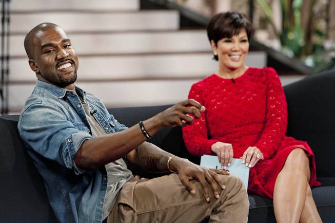 This Aug. 19, 2013, photo shows singer Kanye West with host Kris Jenner during a taping of her talk show "Kris" in Culver City, Calif. West proclaims his love for Jenner's daughter, Kim Kardashian, and their daughter North West in the interview airing Friday, Aug. 23.