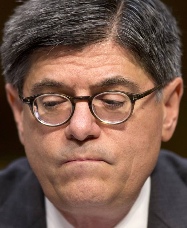 Treasury Secretary Jacob Lew pauses while testifying on Capitol Hill in Washington, Thursday, Oct. 10, 2013, before the Senate Finance Committee to urge Congress to reopen the government and lift the US borrowing cap, conditions President Barack Obama insists on before he will negotiate over the nation's budget ills,.