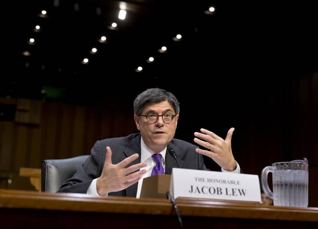 Treasury Secretary Jacob Lew testifies on Capitol Hill in Washington, Thursday, Oct. 10, 2013, before the Senate Finance Committee to urge Congress to reopen the government and lift the US borrowing cap, conditions President Barack Obama insists on before he will negotiate over the nation's budget.