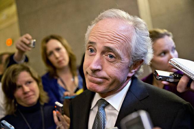 Sen. Bob Corker, R-Tenn., shrugs as he talks to reporters about a two-hour meeting at the White House that he and other Senate Republicans had with President Barack Obama, trying to come up with a bipartisan solution to the budget stalemate, Friday, Oct. 11, 2013, on Capitol Hill in Washington. Republicans from the House of Representatives are offering to pass legislation to avert a potentially catastrophic default and end the 11-day partial government shutdown as part of a framework that would include cuts in benefit programs, officials said Friday.