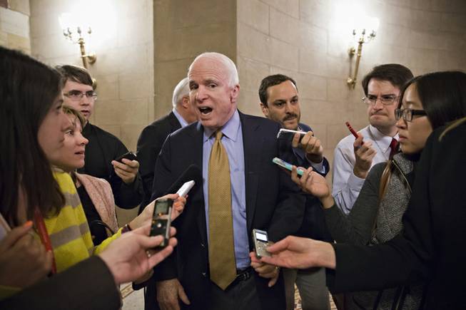 Sen. John McCain, R-Ariz., and other Republican senators return to the Capitol after a two-hour meeting at the White House with President Barack Obama, trying to come up with a bipartisan solution to the budget stalemate, in Washington, Friday, Oct. 11, 2013. Sen. Collins has proposed a six-month extension of government spending, repeal of the medical device tax and greater flexibility for agencies to deal with across-the-board spending cuts in effect this year. The federal government remains partially shut down and faces a first-ever default between Oct. 17 and the end of the month.