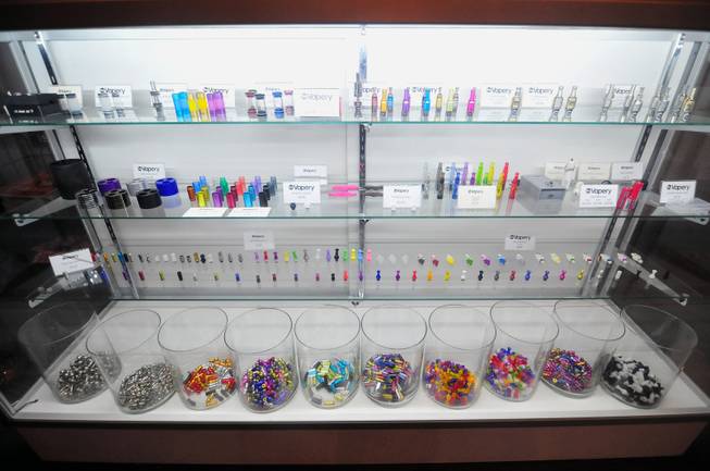 E-cigarette accessories are on display at The Vapery, a vapor shop located at 8060 S. Rainbow Road, on Friday, Oct. 11, 2013. The rise in e-cigarette use among young adults and teenagers is a growing concern among health officials, who have long waged a public health campaign against smoking.
