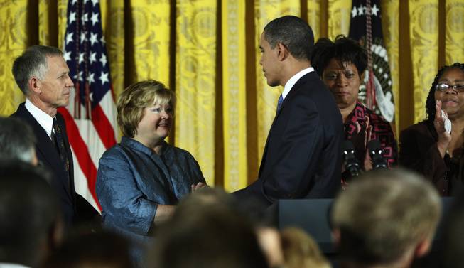 President Barack Obama, greets the parents of Matthew Shepard, Dennis Shepard, left, and Judy Shepard, second left, as James Byrd Jr.'s sisters, Louvon Harris, second right, and Betty Byrd Boatner, right, watch during a White House reception commemorating the enactment of the Matthew Shepard and James Byrd Jr. Hate Crimes Prevention Act, Wednesday, Oct. 28, 2009, in Washington.