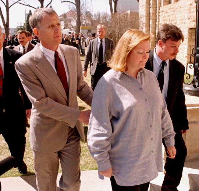 Dennis and Judy Shepard walk back into the Albany County Courthouse after a news conference on the building's front lawn in Laramie, Wyo., Monday, April 5, 1999. Russell Henderson, one of two men standing trial in the October 1998 beating death of their son, Matthew, in this southeast Wyoming college community, agreed to a plea bargain in the case and received two life sentences for his actions in the killing.