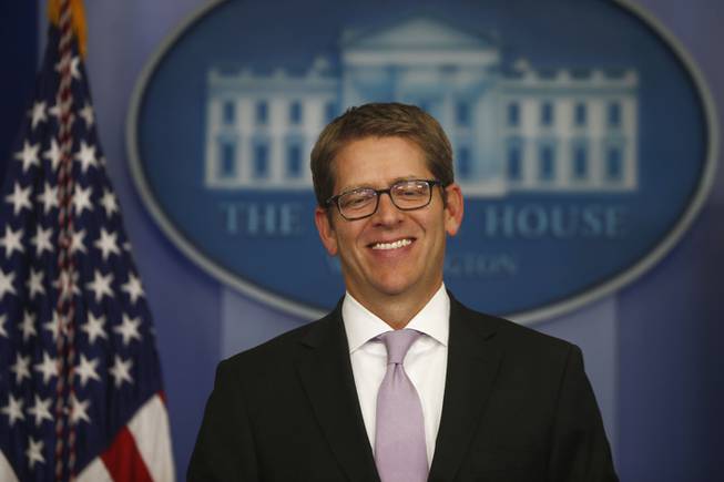 White House Press Secretary Jay Carney smiles as he arrives for the daily press briefing President Barack Obama makes a statement at the White House in Washington, Wednesday, Oct. 16, 2013, after lawmakers reached a bipartisan deal to avoid default and reopen the government. (AP Photo/Charles Dharapak)
