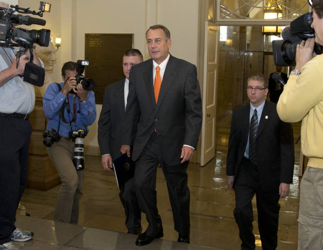 House Speaker John Boehner of Ohio arrives on Capitol Hill, Wednesday, Oct. 16, 2013, in Washington. Chaos among Republicans in the House of Representatives has left it to bipartisan leaders in the Senate to craft a last-minute deal to fend off a looming U.S. default and to reopen the federal government as a partial shutdown entered its 16th day.