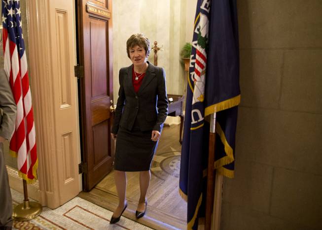 Sen. Susan Collins, R-Maine, walks out of the office of Senate Minority Leader Sen. Mitch McConnell, R-Ky., on Capitol Hill on Wednesday, Oct. 16, 2013 in Washington. The partial government shutdown is in its third week and less than two days before the Treasury Department says it will be unable to borrow and will rely on a cash cushion to pay the country's bills.