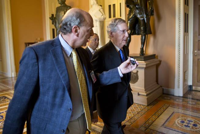 Senate Minority Leader Sen. Mitch McConnell, R-Ky., walks to his office after arriving on Capitol Hill on Wednesday, Oct. 16, 2013 in Washington. The partial government shutdown is in its third week and less than two days before the Treasury Department says it will be unable to borrow and will rely on a cash cushion to pay the country's bills.