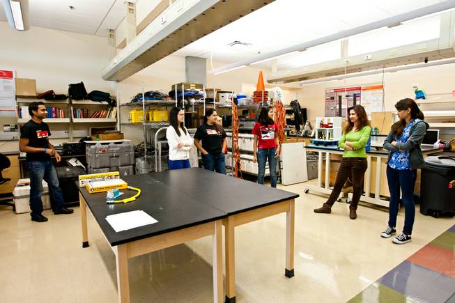 Science and Engineering graduate assistants prepare to drop, cover and hold on as part of the Great Nevada ShakeOut earthquake drill held in the Applied Geophysics Center at UNLV at 10:17 a.m. Thursday morning in Las Vegas, October 17, 2013. From left: Dev Raj Sharma, Chao Chen, Rinu Samuel, Soumya Sagarika, Erfaneh Amoueyan and Indira Khanal.
