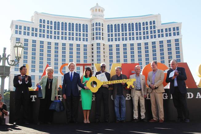 Radio host Manny, Las Vegas Mayor Carolyn Goodman and Clark County Commissioner Steve Sisolak join the cast of the film Last Vegas, from left, Kevin Kline, Mary Steenburgen, Morgan Freeman, Robert De Niro, Michael Douglas and director Jon Turteltaub receive honors from Las Vegas and Clark County Friday, Oct. 18, 2013 in front of the Bellagio.
