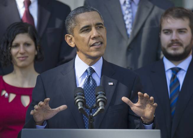 President Barack Obama gestures while speaking in the Rose Garden of the White House in Washington, Monday, Oct. 21, 2013, on the initial rollout of the health care overhaul. Obama acknowledged that the widespread problems with his health care law's rollout are unacceptable, as the administration scrambles to fix the cascade of computer issues.