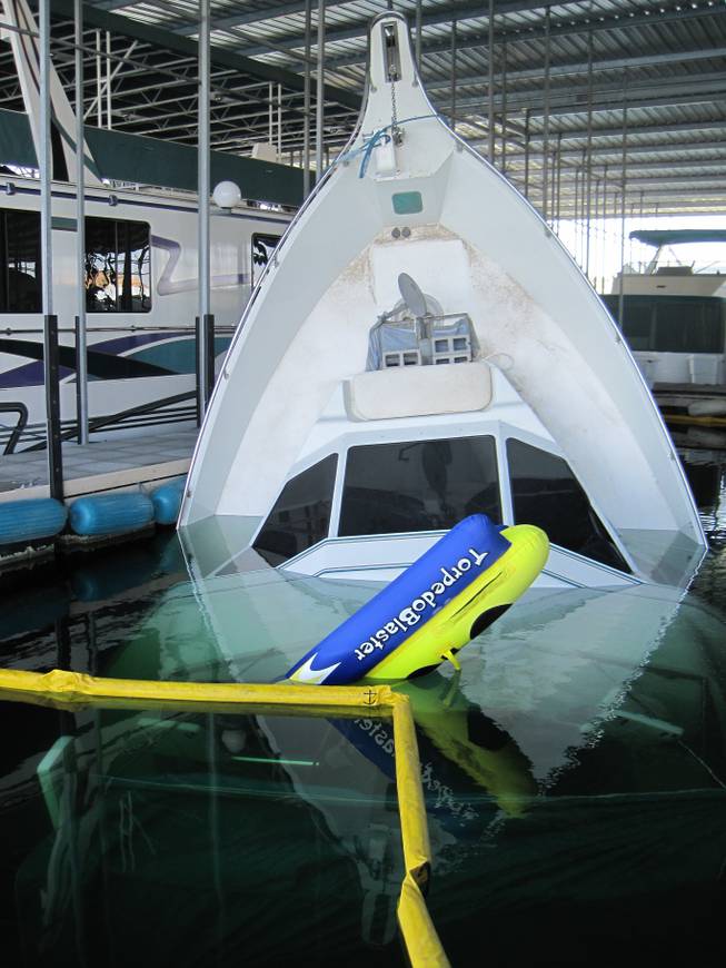 Las Vegas entertainer Wayne Newton's 65-foot yacht nicknamed "Rendezvous" sank while docked at Temple Bar Marina at the Arizona side of Lake Mead on Friday, Oct. 18, 2013. Preliminary investigation by National Park Service rangers indicates that equipment failure caused the ship to take on water.