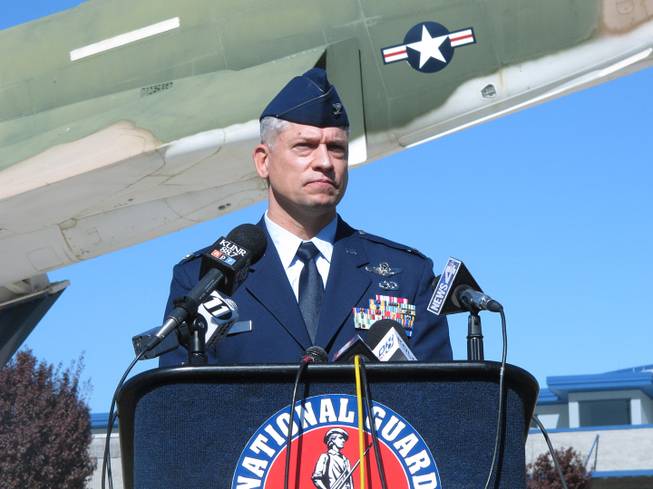 Col. Jeffrey Burkett, commander of the Nevada Air National Guard's 152nd Airlift Wing where Master Sgt. Michael Landsberry served, addresses reporters in Reno, Nev., Tuesday, Oct. 22, 2013 at a news briefing on the air base regarding the shooting at Sparks Middle School that claimed the life of the longtime math teacher and coach the day before.