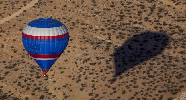 A balloon is ready to set down in a clear spot on the western edge of town Wednesday in advance.of the Second Annual Hot Air Balloon Festival and Carnival taking place this weekend. The event is sponsored by Friends of LVMPD Search and Rescue and Southern Hills Hospital. October 18, 2013