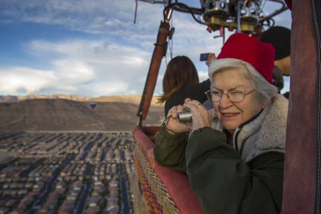 Dona Miller of Moses Lake, Wash., enjoys a balloon ride Wednesday morning with Vegas Balloon Rides for her 80th birthday. The crew will be joining the Second Annual Hot Air Balloon Festival and Carnival taking place this weekend sponsored by Friends of LVMPD Search and Rescue and Southern Hills Hospital. October 18, 2013.