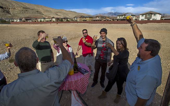 Riders and crew with Vegas Balloon Rides celebrate a flawless flight Wednesday helping to promote the Second Annual Hot Air Balloon Festival and Carnival taking place this weekend. The event is sponsored by Friends of LVMPD Search and Rescue and Southern Hills Hospital. October 18, 2013.