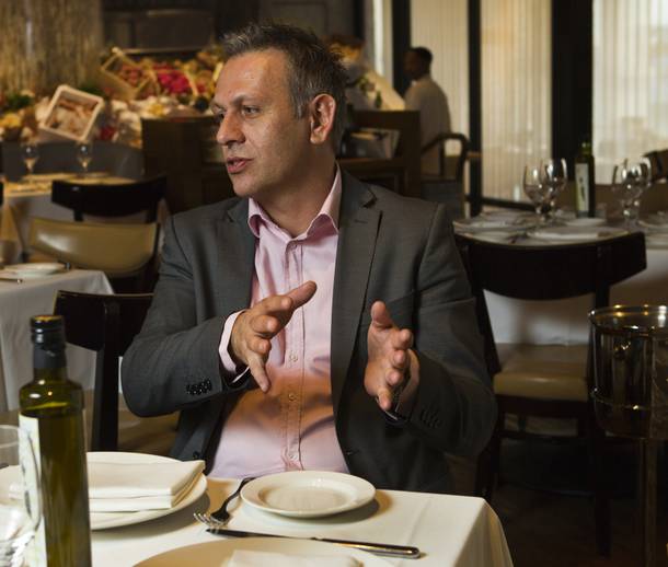 Milos General Manager Savvas Georgiadis explains the process of shipping in fresh seafood for their customers at the Cosmopolitain, Wednesday Oct. 23, 2013.