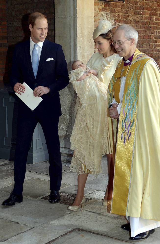 Britain's Prince William, right, Kate Duchess of Cambridge with their son Prince George leave the Chapel Royal in St James's Palace in London, with the Archbishop of Canterbury Justin Welby after the christening of the three month-old Prince George, Wednesday Oct. 23, 2013. Prince George was christened Wednesday with water from the River Jordan at a rare four-generation gathering of the royal family in London.