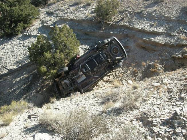 This Oct. 18, 2013, photo released by the Utah Highway Patrol shows a vehicle in a ravine where David Welch was found on Oct. 18, 2013, in eastern Utah. Welch, 54, went missing from Manhattan, Kan., on Sept. 2, 2013. Welch spent his final days trapped in the wreckage of his van in a rural Utah ravine writing goodbye letters to the family he unexpectedly left in early September.