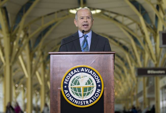 Federal Aviation Administration (FAA) Administrator Michael Huerta announces that government safety rules are changing to let airline passengers use most electronic devices from gate-to-gate during a news conference, Thursday, Oct. 31, 2013, at Washington's Ronald Reagan National Airport. The change will let passengers read, work, play games, watch movies and listen to music — but not make cellphone calls.