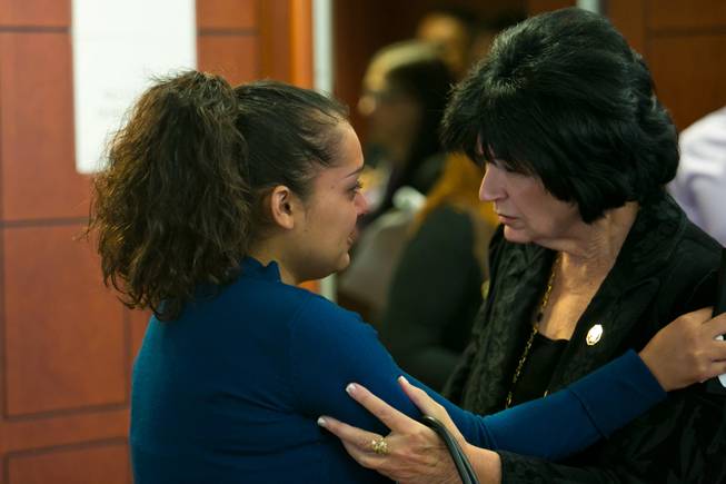 Jessica Amaya, left, speaks to Sandy Heverly, executive director for STOP DUI, after the sentencing hearing for Gary Lee Hosey Jr. at the Regional Justice Center, Friday, Nov. 1, 2013. Amaya's brother Gerber Ayala-Tomasino Jr. was one of four people killed when a car driven by Hosey crashed into a bus stop in September 2012.