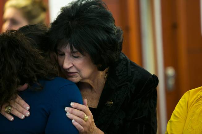 Jessica Amaya, left, receives comfort from Sandy Heverly, executive director for STOP DUI, after the sentencing hearing for Gary Lee Hosey Jr. at the Regional Justice Center, Friday, Nov. 1, 2013. Amaya's brother Gerber Ayala-Tomasino Jr. was one of four people killed when a car driven by Hosey crashed into a bus stop in September 2012.