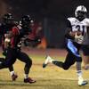 Photo: (From right) Canyon Springs Kyhren Howard runs by Photo: (From right) Canyon Springs Kyhren Howard runs by