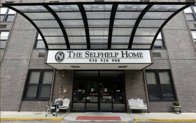 In this Oct. 4, 2013 photo, a resident sits outside the retirement community called Selfhelp Home, on the North Side of Chicago. For decades, the home was a refuge for central European Jews who'd been victims of Nazi persecution. But as time has passed, the need for this kind of special sanctuary has faded. Only 12 Holocaust survivors _ the youngest in their mid-80s, the oldest 103 _ now remain, along with dozens of others who fled their homeland, escaping Hitlers reach. Theyre now part of the last generation to survive one of the greatest horrors of all time. (AP Photo/M. Spencer Green)