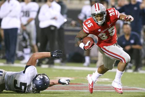 UNLV running back Tim Cornett gets past Utah State linebacker Jake Doughty during their game Saturday, Nov. 9, 2013 at Sam Boyd Stadium. Utah State won the game 28-24.