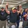 Photo: Boeing machinists react as the results of a vote a Photo: Boeing machinists react as the results of a vote a