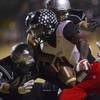 Las Vegas runner Elias Miller (4) loses the ball from a hit by Green Valley's Cody Milner (20) with a critical fumble in the fourth quarter. Green Valley High School defeated Las Vegas 47-34 during their football playoff game on Friday, Nov. 15, 2013. Las Vegas runner Elias Miller (4) loses the ball from a hit by Green Valley's Cody Milner (20) with a critical fumble in the fourth quarter. Green Valley High School defeated Las Vegas 47-34 during their football playoff game on Friday, Nov. 15, 2013.