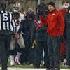UNLV head coach Bobby Hauck, right, argues for a call against Air Force with side judge Craig Falkner in the first quarter of an NCAA football game at Air Force Academy, Colo., on Thursday, Nov. 21, 2013. (AP Photo/David Zalubowski) UNLV head coach Bobby Hauck, right, argues for a call against Air Force with side judge Craig Falkner in the first quarter of an NCAA football game at Air Force Academy, Colo., on Thursday, Nov. 21, 2013. (AP Photo/David Zalubowski)